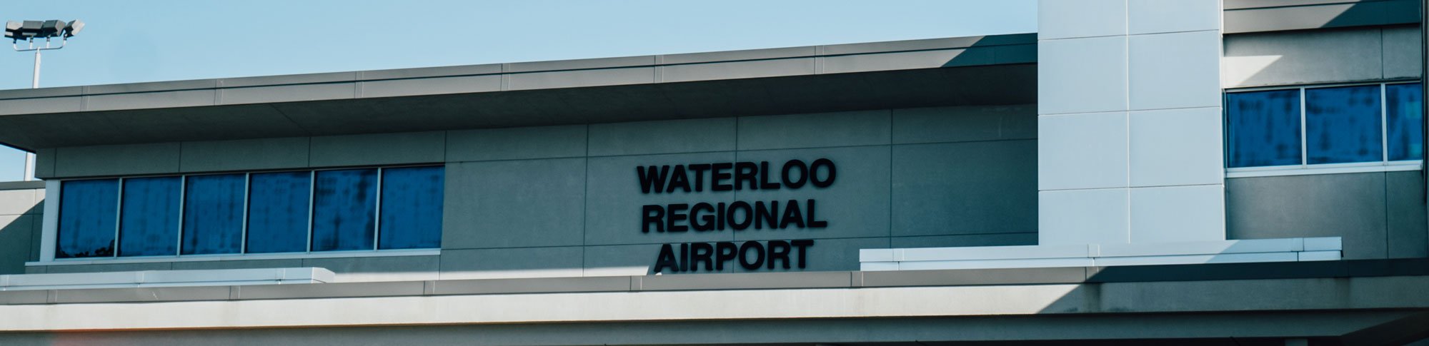 A picture of the outside building of the Waterloo Regional Airport.